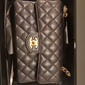 Elegant Black Quilted Clutch with Gold Accents